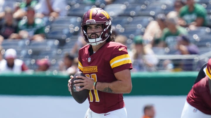 Aug 10, 2024; East Rutherford, New Jersey, USA; Washington Commanders quarterback Sam Hartman (11) surveys the field during the third quarter against the New York Jets at MetLife Stadium. Mandatory Credit: Lucas Boland-USA TODAY Sports