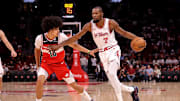 Nov 12, 2025; Houston, Texas, USA; Houston Rockets forward Kevin Durant (7) handles the ball against Washington Wizards forward Kyshawn George (18) during the first quarter at Toyota Center. Mandatory Credit: Erik Williams-Imagn Images