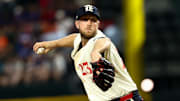 Sep 5, 2025; Arlington, Texas, USA;  Texas Rangers starting pitcher Merrill Kelly (23) throws during the fourth inning against the Houston Astros at Globe Life Field. Mandatory Credit: Kevin Jairaj-Imagn Images