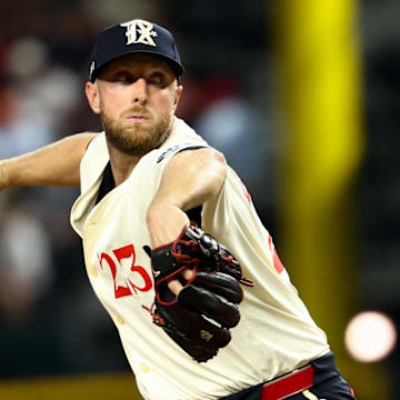 Sep 5, 2025; Arlington, Texas, USA;  Texas Rangers starting pitcher Merrill Kelly (23) throws during the fourth inning against the Houston Astros at Globe Life Field. Mandatory Credit: Kevin Jairaj-Imagn Images