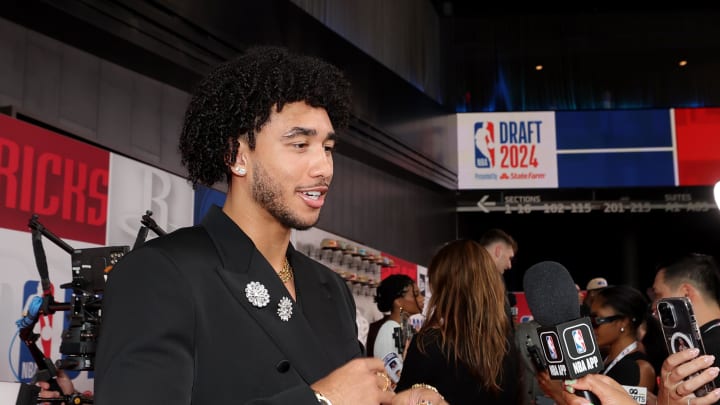 Jun 26, 2024; Brooklyn, NY, USA; Jared McCain is interviewed on the red carpet after arriving for the first round of the 2024 NBA Draft at Barclays Center. Mandatory Credit: Brad Penner-USA TODAY Sports