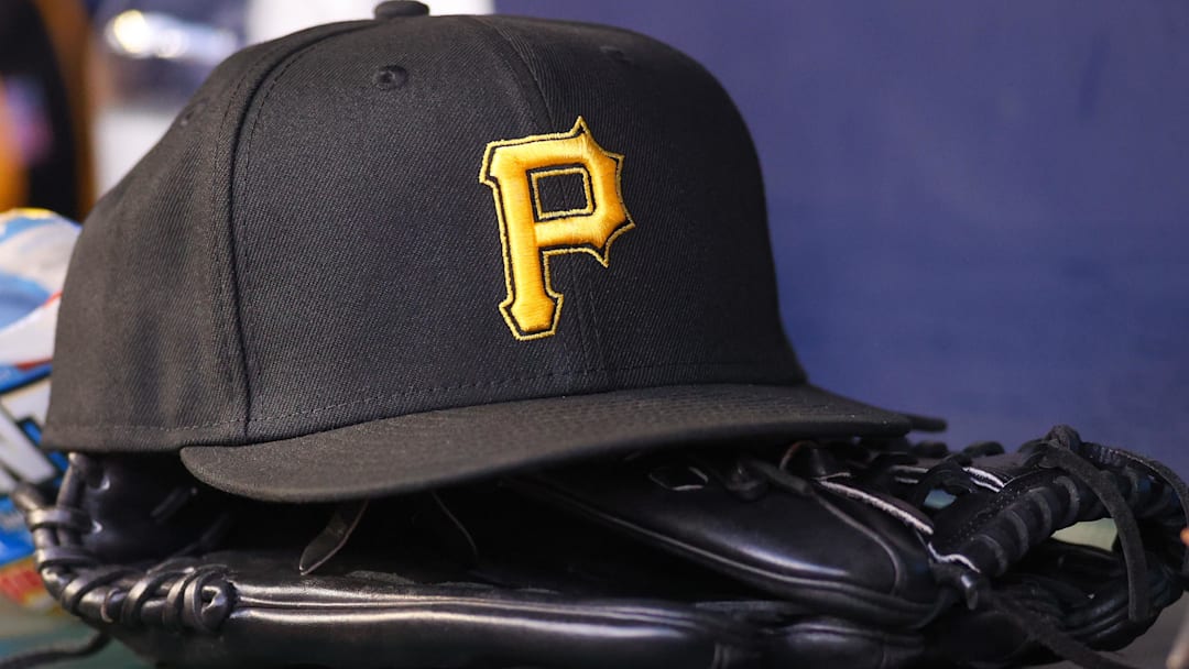 Sep 8, 2023; Atlanta, Georgia, USA; A detailed view of a Pittsburgh Pirates hat and glove before a game against the Pittsburgh Pirates in the first inning at Truist Park. Mandatory Credit: Brett Davis-Imagn Images