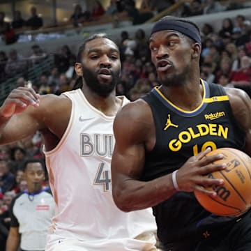 Feb 8, 2025; Chicago, Illinois, USA; Chicago Bulls forward Patrick Williams (44) defends Golden State Warriors forward Jimmy Butler (10) during the first half at United Center. Mandatory Credit: David Banks-Imagn Images