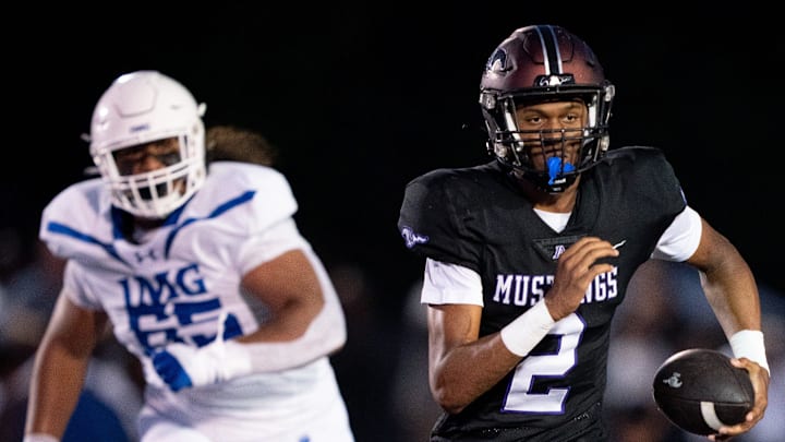 Lipscomb's Deuce Knight (2) runs away from IMG's Jayden Jackson (65) at Lipscomb's Reese Smith Football Field in Nashville, Tenn., Friday night, Aug. 18, 2023.
