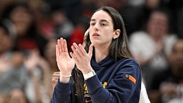 Aug 1, 2025; Dallas, Texas, USA;  Indiana Fever guard Caitlin Clark (22) cheers for her team during the first half against the Dallas Wings at the American Airlines Center. Mandatory Credit: Jerome Miron-Imagn Images