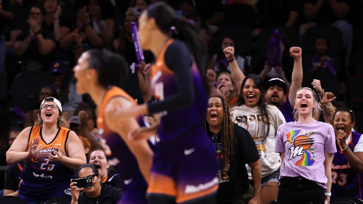 Jul 9, 2025; Phoenix, Arizona, USA; Phoenix Mercury fans in the crowd celebrate the shot by forward Alyssa Thomas against the Minnesota Lynx during the second half at PHX Arena. Mandatory Credit: Mark J. Rebilas-Imagn Images