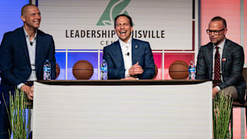 Louisville Mayor Craig Greenberg, center, shared a laugh with Louisville basketball coach Pat Kelsey and Kentucky basketball coach Mark Pope at the 2024 Leadership Louisville Luncheon at the Kentucky International Convention Center in downtown Louisville on Wednesday, August 28, 2024.