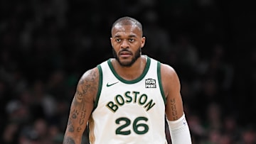 Apr 7, 2024; Boston, Massachusetts, USA; Boston Celtics forward Xavier Tillman Sr. (26) looks on during the second half against the Portland Trail Blazers at TD Garden. Mandatory Credit: Eric Canha-Imagn Images