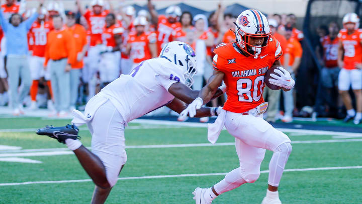 Sep 2, 2023; Stillwater, Oklahoma, USA; Oklahoma State's Brennan Presley (80) runs the ball for a touchdown against Central Arkansas in the first quarter at Boone Pickens Stadium. Mandatory Credit: Nathan J. Fish-USA TODAY Sports