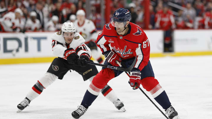 Apr 7, 2024; Washington, District of Columbia, USA; Washington Capitals left wing Max Pacioretty (67) skates with the puck as Ottawa Senators center Ridly Greig (71) defends in the third period at Capital One Arena. Mandatory Credit: Geoff Burke-USA TODAY Sports