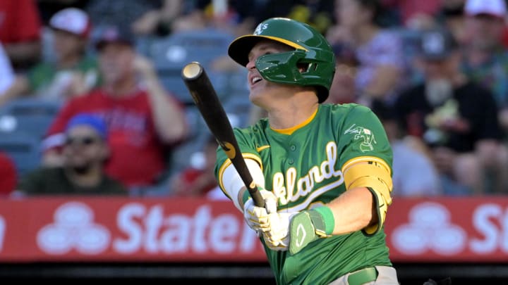 Jun 24, 2024; Anaheim, California, USA;  Oakland Athletics right fielder Tyler Nevin (26) hits a solo home run in the second inning against the Los Angeles Angels at Angel Stadium. Mandatory Credit: Jayne Kamin-Oncea-USA TODAY Sports