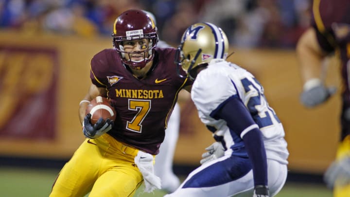 Sep 13, 2008; Minneapolis, MN, USA: Minnesota Gophers wide receiver Eric Decker (7) runs his reception in front of Montana State Bobcats cornerback Arnold Briggs (26) in the third quarter at the Metrodome. Minnesota defeated Montana State 35-23. Mandatory credit: Bruce Kluckhohn USA TODAY Sports