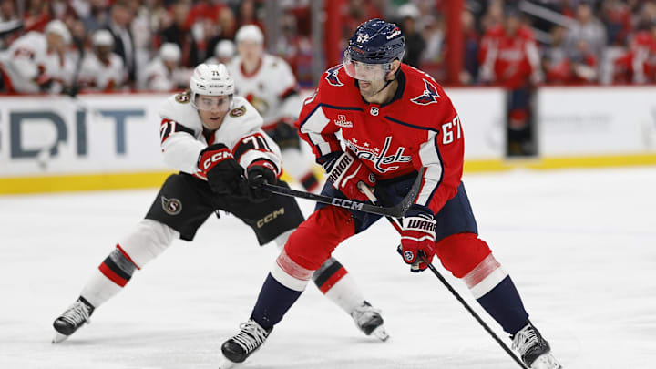 Apr 7, 2024; Washington, District of Columbia, USA; Washington Capitals left wing Max Pacioretty (67) skates with the puck as Ottawa Senators center Ridly Greig (71) defends in the third period at Capital One Arena. Mandatory Credit: Geoff Burke-Imagn Images