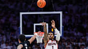 Arizona Wildcats guard Caleb Love (1) shoots a half-court shot at the buzzer to tie the game against the Iowa State Cyclones at McKale Center.