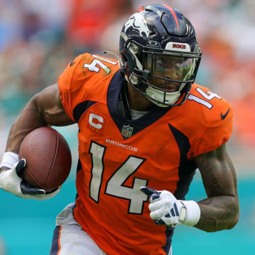 Sep 24, 2023; Miami Gardens, Florida, USA;  Denver Broncos wide receiver Courtland Sutton (14) runs with the ball against the Miami Dolphins in the third quarter at Hard Rock Stadium. Mandatory Credit: Nathan Ray Seebeck-USA TODAY Sports