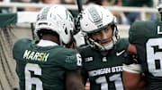 Oct 11, 2025; East Lansing, Michigan, USA; Michigan State wide receiver Nick Marsh (6) celebrates a touchdown against the UCLA Bruins with quarterback Alessio Milivojevic (11) in the fourth quarter at Spartan Stadium. Mandatory Credit: Brendan Mullin-Imagn Images