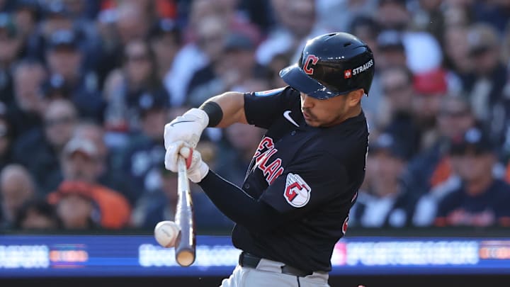Oct 9, 2024; Detroit, Michigan, USA; Cleveland Guardians outfielder Steven Kwan (38) hits a single against the Detroit Tigers in the seventh inning in game three of the ALDS for the 2024 MLB Playoffs at Comerica Park. Mandatory Credit: David Reginek-Imagn Images