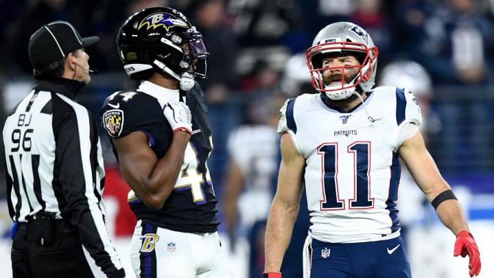 New England Patriots wide receiver Julian Edelman (11) and Baltimore Ravens cornerback Marlon Humphrey (44) exchange words during the second quarter at M&T Bank Stadium. 