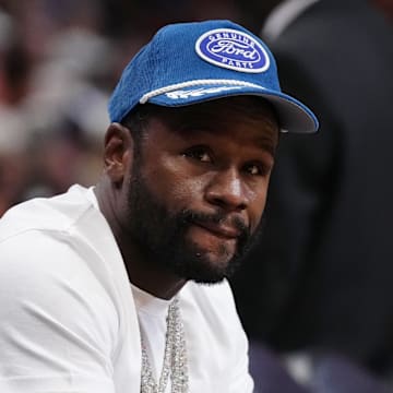 Nov 6, 2023; Miami, Florida, USA; Former boxer Floyd Mayweather Jr. sits court side during the second half between the Miami Heat and the Los Angeles Lakers at Kaseya Center. Mandatory Credit: Jasen Vinlove-Imagn Images