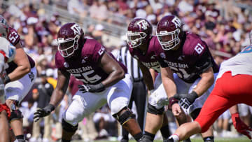 Sep 18, 2021; College Station, Texas, USA; Texas A&M Aggies offensive lineman Kenyon Green (55) and offensive lineman Bryce Foster (61) in action during the game between the Texas A&M Aggies and the New Mexico Lobos at Kyle Field. Mandatory Credit: Jerome Miron-USA TODAY Sports