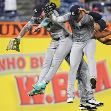 Jul 29, 2024; Philadelphia, Pennsylvania, USA; New York Yankees outfielder Alex Verdugo (24), outfielder Juan Soto (22) and outfielder Trent Grisham (12) celebrate win against the Philadelphia Phillies at Citizens Bank Park. Mandatory Credit: Eric Hartline-USA TODAY Sports