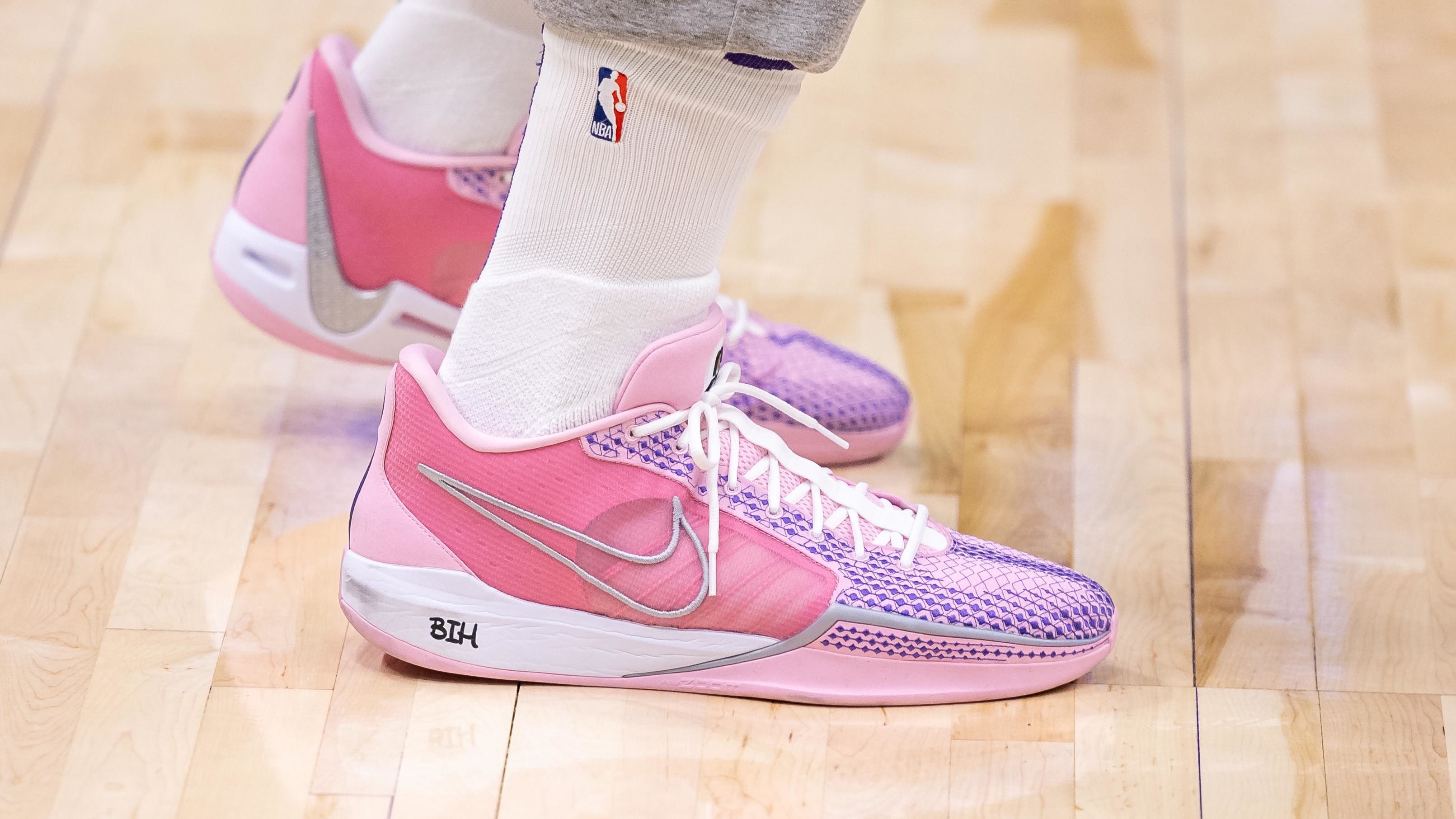 Sabrina Ionescu's pink and white Nike sneakers.
