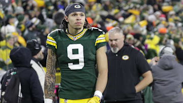 Dec 23, 2024; Green Bay, Wisconsin, USA;  Green Bay Packers wide receiver Christian Watson (9) leaves the field in the fourth quarter after getting injured against the New Orleans Saints at Lambeau Field.