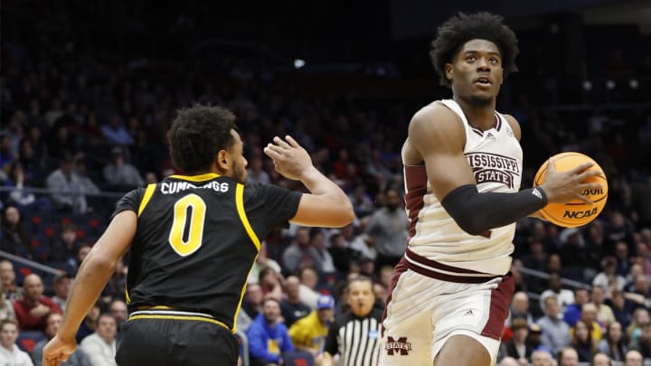 Mar 14, 2023; Dayton, OH, USA; Mississippi State Bulldogs guard Cameron Matthews (4) goes to the basket pressured by Pittsburgh Panthers guard Nelly Cummings (0) in the second half at UD Arena. Mandatory Credit: Rick Osentoski-USA TODAY Sports