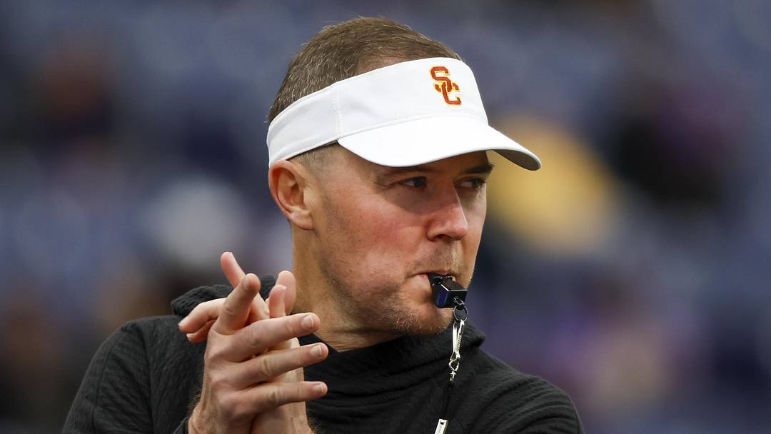 Nov 2, 2024; Seattle, Washington, USA; USC Trojans head coach Lincoln Riley watches pregame warmups against the Washington Huskies at Alaska Airlines Field at Husky Stadium. Mandatory Credit: Joe Nicholson-Imagn Images Nov 2, 2024; Seattle, Washington, USA; USC Trojans head coach Lincoln Riley watches pregame warmups against the Washington Huskies at Alaska Airlines Field at Husky Stadium. Mandatory Credit: Joe Nicholson-Imagn Images
