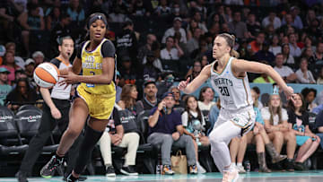 Jul 3, 2025; Brooklyn, New York, USA;  Los Angeles Sparks forward Rickea Jackson (2) drives past New York Liberty guard Sabrina Ionescu (20) in the first quarter at Barclays Center. Mandatory Credit: Wendell Cruz-Imagn Images