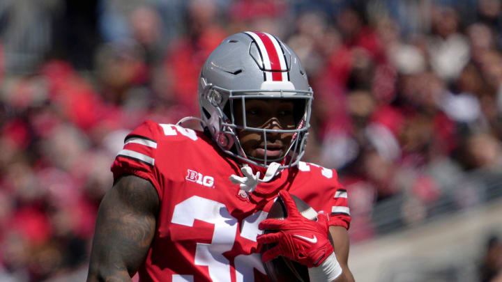 April 13, 2024; Columbus, Ohio, USA; 
Ohio State Buckeyes running back TreVeyon Henderson (32) runs the ball for the scarlet team during the first half of the LifeSports spring football game at Ohio Stadium on Saturday.