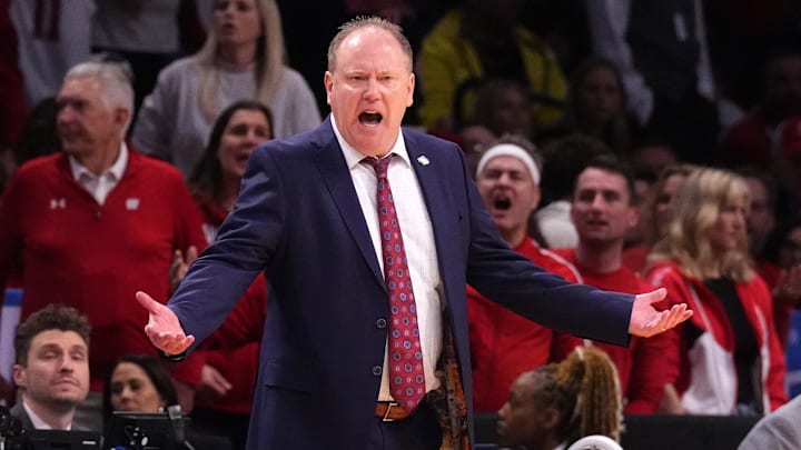 Mar 22, 2024; Brooklyn, NY, USA; Wisconsin Badgers head coach Greg Gard reacts against the James Madison Dukes in the first round of the 2024 NCAA Tournament at the Barclays Center. Mandatory Credit: Robert Deutsch-Imagn Images Mar 22, 2024; Brooklyn, NY, USA; Wisconsin Badgers head coach Greg Gard reacts against the James Madison Dukes in the first round of the 2024 NCAA Tournament at the Barclays Center. Mandatory Credit: Robert Deutsch-Imagn Images