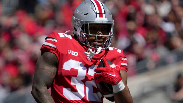 April 13, 2024; Columbus, Ohio, USA; 
Ohio State Buckeyes running back TreVeyon Henderson (32) runs the ball for the scarlet team during the first half of the LifeSports spring football game at Ohio Stadium on Saturday.