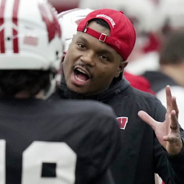 Wisconsin wide receivers coach Jordan Reid talks to quarterback Danny O’Neil during spring football practice Thursday, April 3, 2025 in Madison, Wisconsin