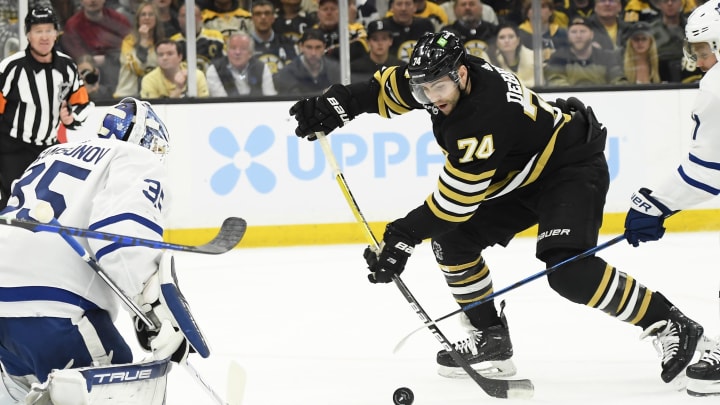 May 4, 2024; Boston, Massachusetts, USA; Boston Bruins left wing Jake DeBrusk (74) shoots the puck towards Toronto Maple Leafs goaltender Ilya Samsonov (35) during the first period in game seven of the first round of the 2024 Stanley Cup Playoffs at TD Garden. Mandatory Credit: Bob DeChiara-USA TODAY Sports