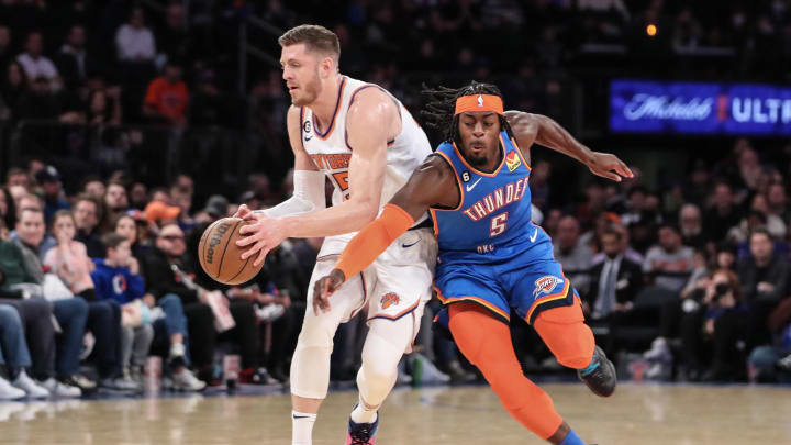 Nov 13, 2022; New York, New York, USA; Oklahoma City Thunder forward Luguentz Dort (5) tries to steal the ball form New York Knicks center Isaiah Hartenstein (55) in the first half at Madison Square Garden. Mandatory Credit: Wendell Cruz-USA TODAY Sports