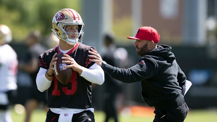 Jun 11, 2025; Santa Clara, CA, USA; San Francisco 49ers quarterbacks coach harasses Brock Purdy (13) in a passing drill during a team OTA at Levi's Stadium. Mandatory Credit: D. Ross Cameron-Imagn Images Jun 11, 2025; Santa Clara, CA, USA; San Francisco 49ers quarterbacks coach harasses Brock Purdy (13) in a passing drill during a team OTA at Levi's Stadium. Mandatory Credit: D. Ross Cameron-Imagn Images