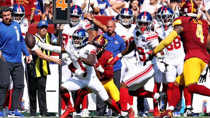 Sep 15, 2024; Landover, Maryland, USA; New York Giants wide receiver Malik Nabers (1) reaches for a first down during the fourth quarter against the Washington Commanders at Commanders Field.  