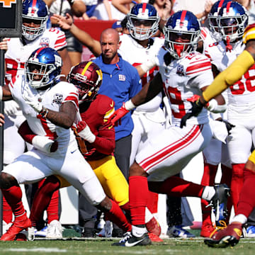 Sep 15, 2024; Landover, Maryland, USA; New York Giants wide receiver Malik Nabers (1) reaches for a first down during the fourth quarter against the Washington Commanders.