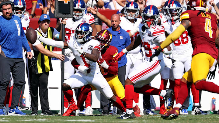 Sep 15, 2024; Landover, Maryland, USA; New York Giants wide receiver Malik Nabers (1) reaches for a first down during the fourth quarter against the Washington Commanders.