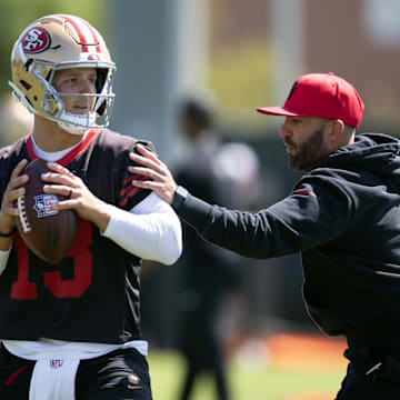 Jun 11, 2025; Santa Clara, CA, USA; San Francisco 49ers quarterbacks coach harasses Brock Purdy (13) in a passing drill during a team OTA at Levi's Stadium. Mandatory Credit: D. Ross Cameron-Imagn Images