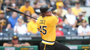 Jun 5, 2016; Pittsburgh, PA, USA; Pittsburgh Pirates starting pitcher Gerrit Cole (45) hits a single against the Los Angeles Angels during the sixth inning at PNC Park. Mandatory Credit: Charles LeClaire-Imagn Images