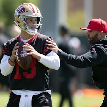 Jun 11, 2025; Santa Clara, CA, USA; San Francisco 49ers quarterbacks coach harasses Brock Purdy (13) in a passing drill during a team OTA at Levi's Stadium. Mandatory Credit: D. Ross Cameron-Imagn Images