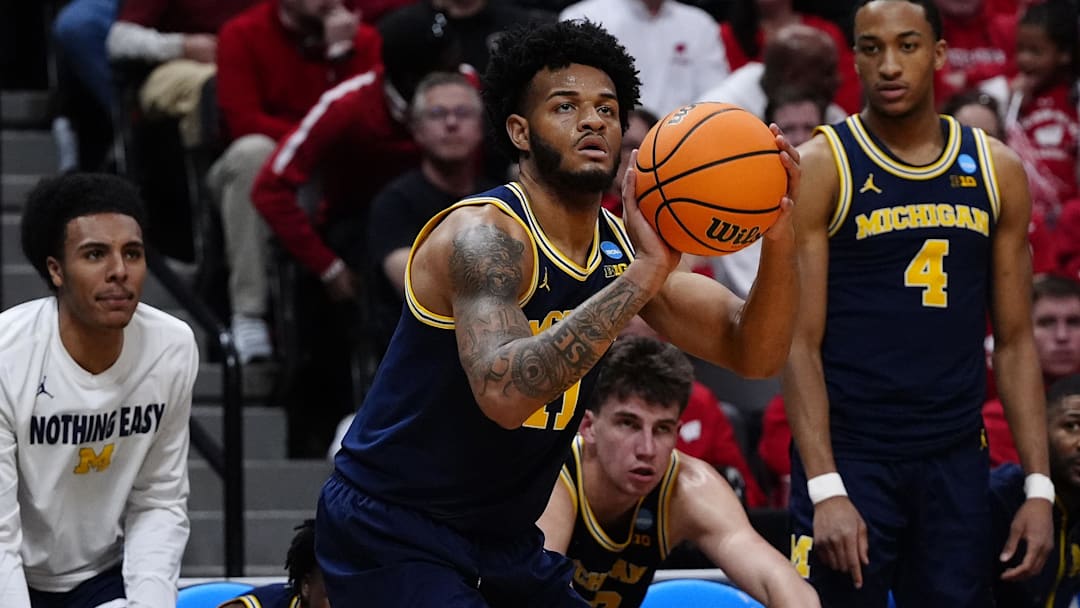 Mar 22, 2025; Denver, CO, USA; Michigan Wolverines guard Roddy Gayle Jr. (11) shoots the ball against the Texas A&M Aggies during the second half in the second round of the NCAA Tournament  at Ball Arena. Mandatory Credit: Ron Chenoy-Imagn Images