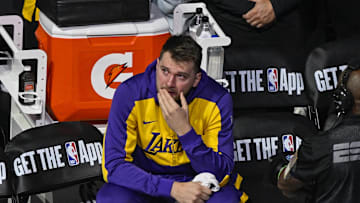 Apr 9, 2025; Dallas, Texas, USA; Los Angeles Lakers guard Luka Doncic (77) looks on as the Dallas Mavericks play a tribute video for Doncic before the game against the Lakers at the American Airlines Center. Mandatory Credit: Jerome Miron-Imagn Images