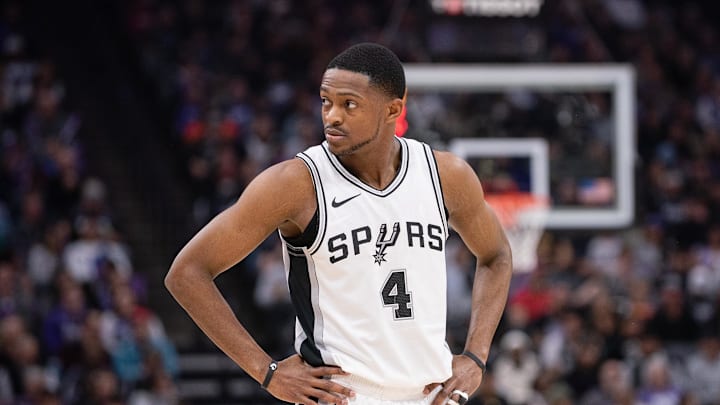 Mar 7, 2025; Sacramento, California, USA; San Antonio Spurs guard De'Aaron Fox (4) looks on during the first quarter of the game against the Sacramento Kings at Golden 1 Center. Mandatory Credit: Ed Szczepanski-Imagn Images