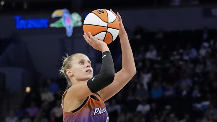Jul 16, 2025; Minneapolis, Minnesota, USA; Phoenix Mercury guard Kitija Laksa (9) shoots against the Minnesota Lynx in the third quarter at Target Center. Mandatory Credit: Bruce Kluckhohn-Imagn Images