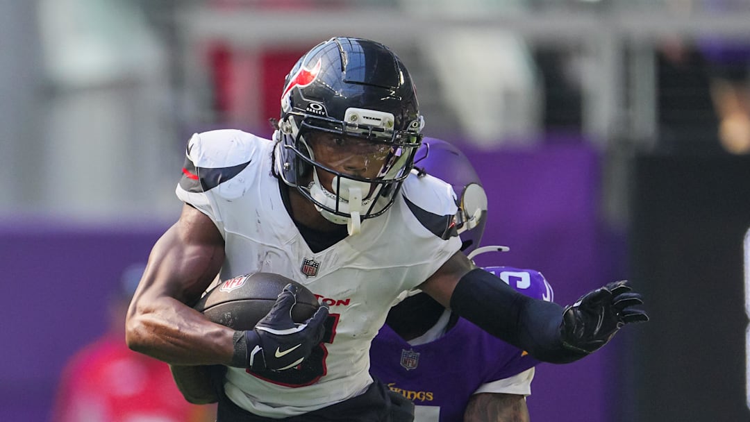 Aug 9, 2025; Minneapolis, Minnesota, USA; Houston Texans wide receiver John Metchie III (8) runs after the catch against the Minnesota Vikings in the third quarter at U.S. Bank Stadium. Mandatory Credit: Brad Rempel-Imagn Images