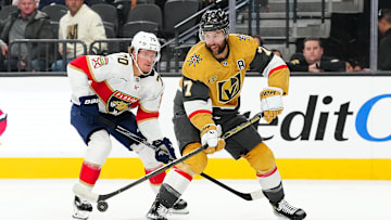 Jan 26, 2025; Las Vegas, Nevada, USA; Vegas Golden Knights defenseman Alex Pietrangelo (7) tips the puck away from Florida Panthers center Jesper Boqvist (70) during the first period at T-Mobile Arena. Mandatory Credit: Stephen R. Sylvanie-Imagn Images