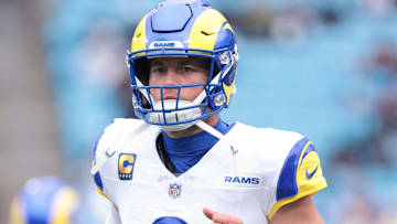 Nov 30, 2025; Charlotte, North Carolina, USA; Los Angeles Rams quarterback Matthew Stafford (9) warms up before the game against the Carolina Panthers at Bank of America Stadium. Mandatory Credit: Scott Kinser-Imagn Images